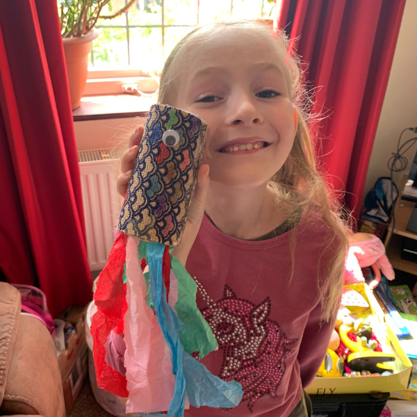 children engaged in interactive home education learning activities UK